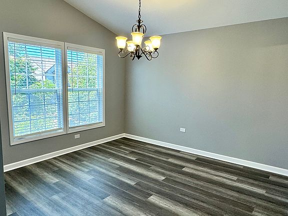 Dining room with vaulted ceiling