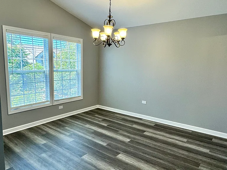 Dining room with vaulted ceiling