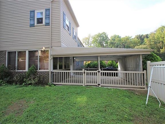 Here is a picture from the fenced side yard showing an external view of the rear covered patio. You can conveniently and safely 