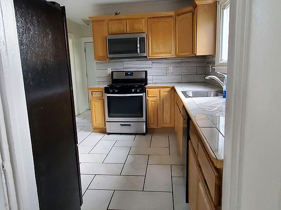 KITCHEN (VIEW FROM LIVING ROOM)