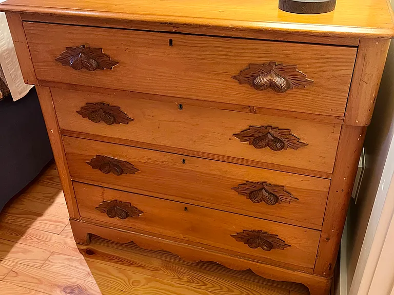 Full sized dresser for clothing storage.