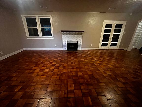 Living room, fireplace, and French doors to Florida room