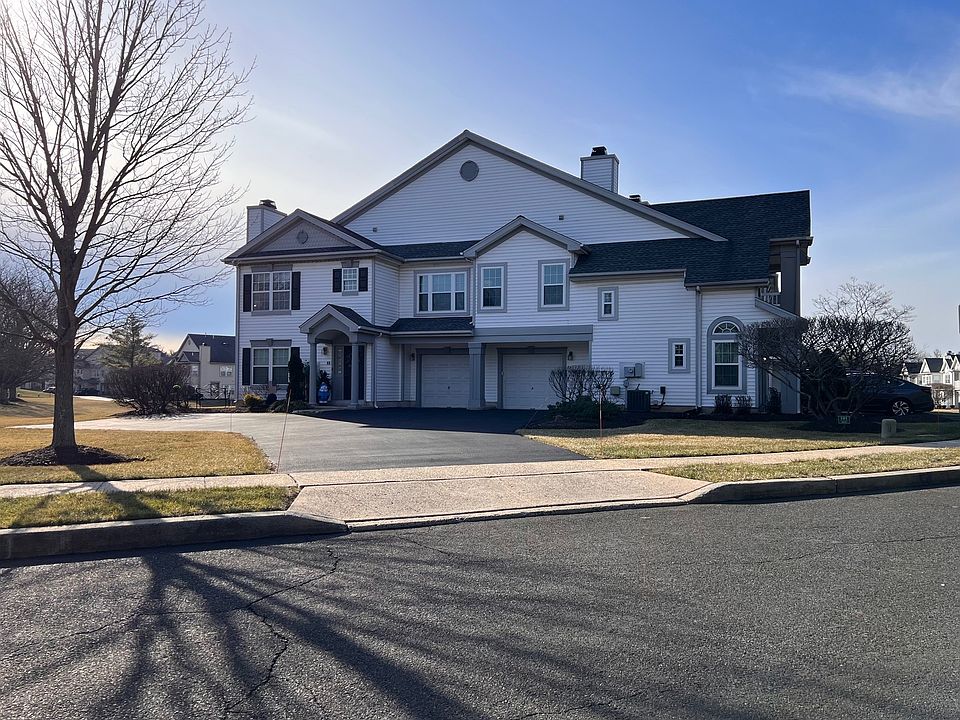 Condo driveway with garage