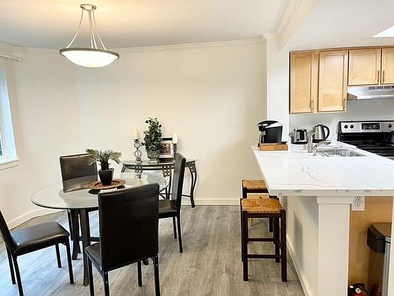 Updated kitchen with a large dining room and eating bar.