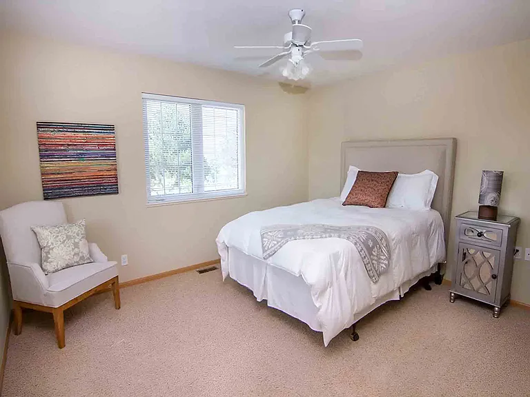 Spacious bedrooms offer a peaceful retreat, complete with natural light and soft carpeting.