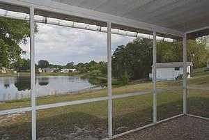 Screened porch with water view