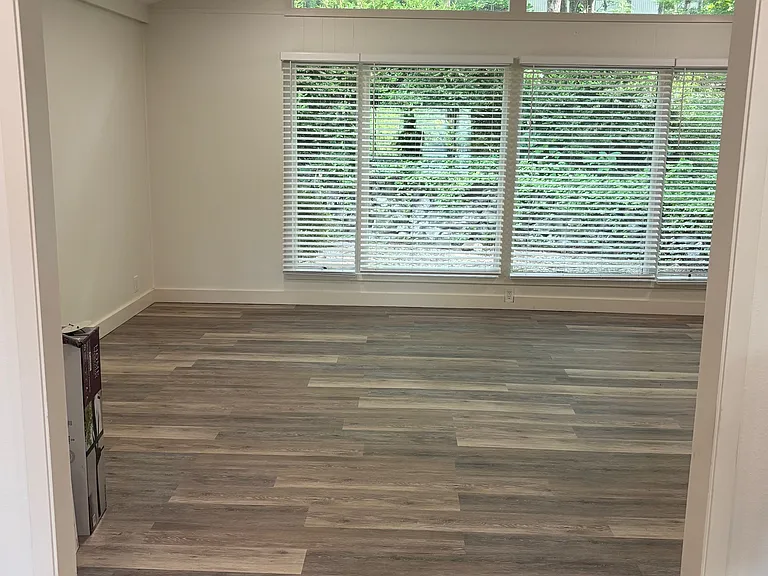 family room with vaulted ceilings and great windows to cozy and lovely back patio