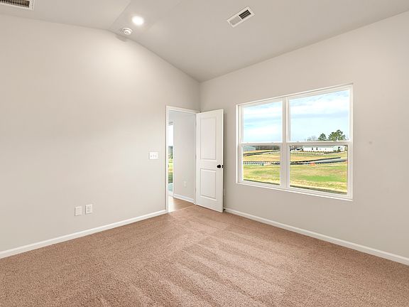 Master bedroom with a large picture window