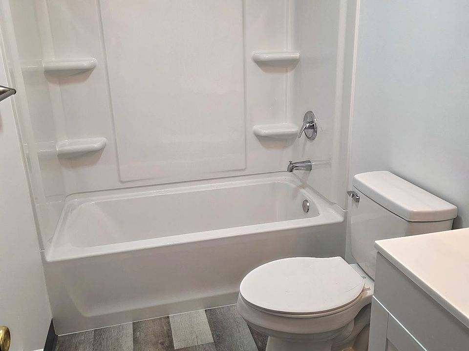 The newly renovated upstairs full bathroom