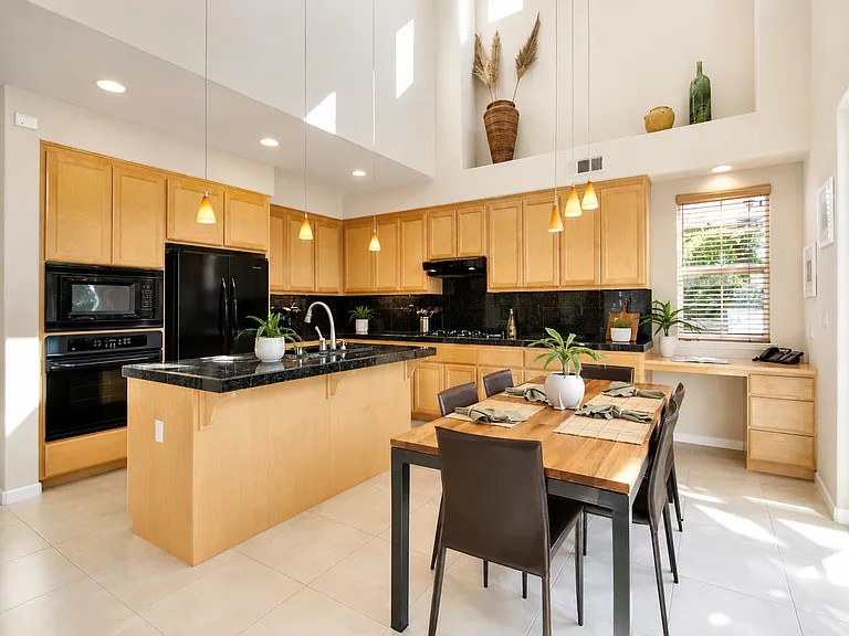 Spacious kitchen with abundant cabinetry and breakfast bar.