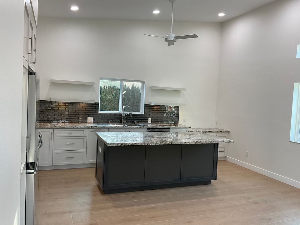 Walk into a spacous kitchen and living area