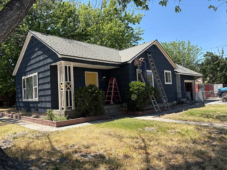 4th Street side. Cedar wood shingles in a Moody Blue.