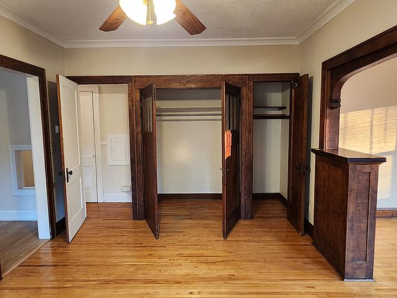 Dining room view of the door to kitchen (left), door to hallway, walk-in closet, coat closet, LR to right, and front door to the front entry of the building.