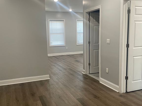 Living room view from kitchen. Bathroom and bedroom to the right
