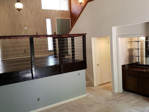 Den looking up to Master Bedroom