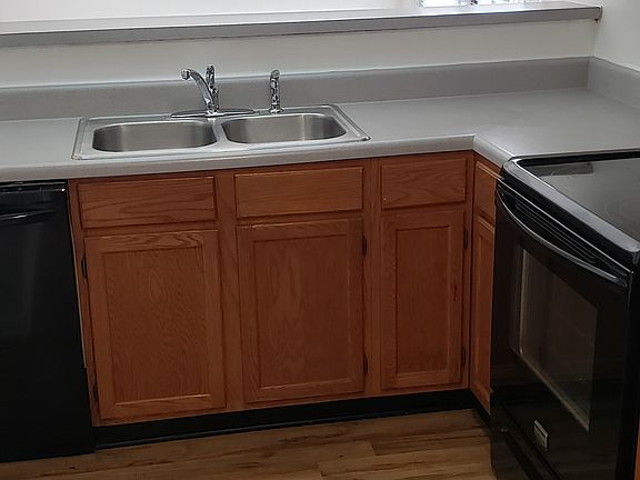 Kitchen area with counter for extra dinning seating.