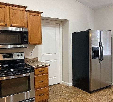 Kitchen w/pantry door & fridge