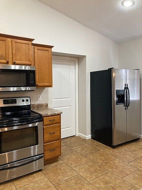 Kitchen w/pantry door & fridge