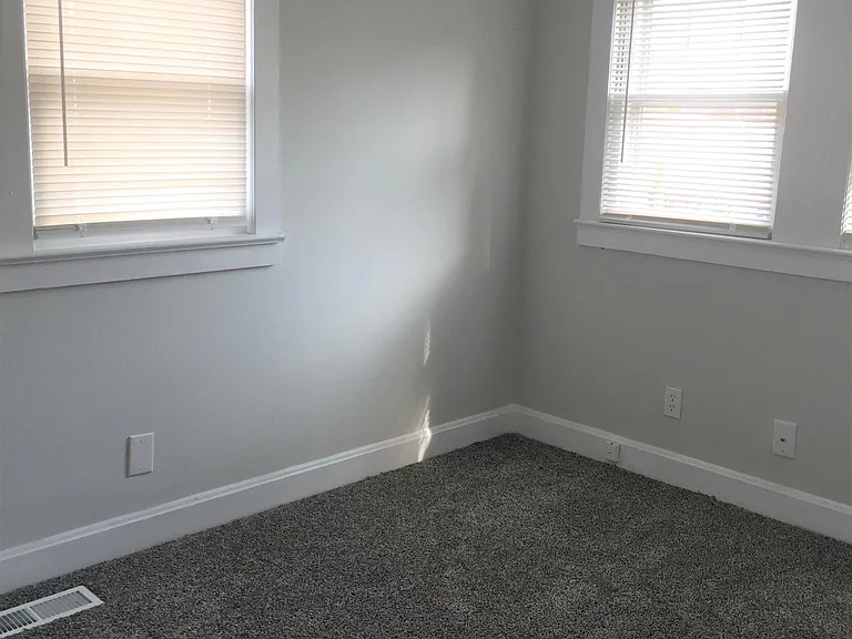 Master Bedroom off the kitchen on the right.