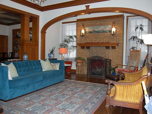 Formal living with firrplace that has gas logs.