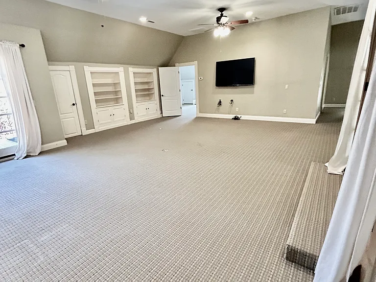 recreation/media room with built in bookcases