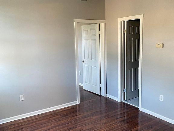 large living space with high ceilings and exposed central vents