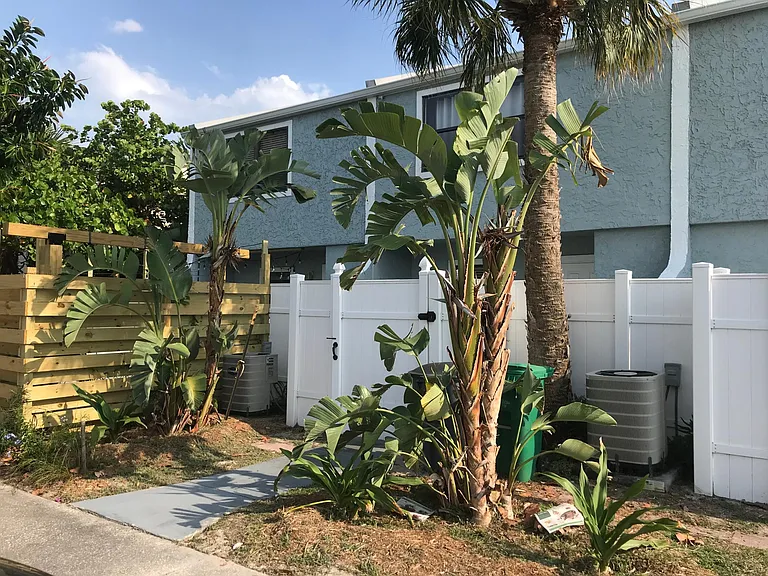 Rear of the house with private 15x15 foot patio and outdoor storage closet.