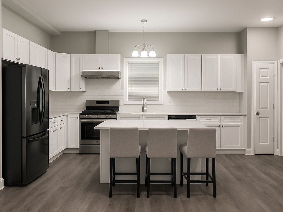 kitchen island with new cabinets all around