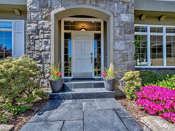 Gorgeous Curb Appeal Welcomes You Upon Entering The Home.>
