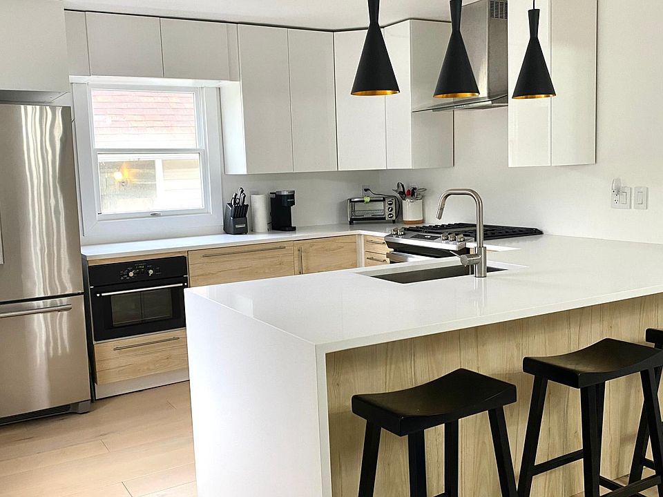 Remodeled kitchen featuring stainless steel appliances, a gas stove, and quartz countertops