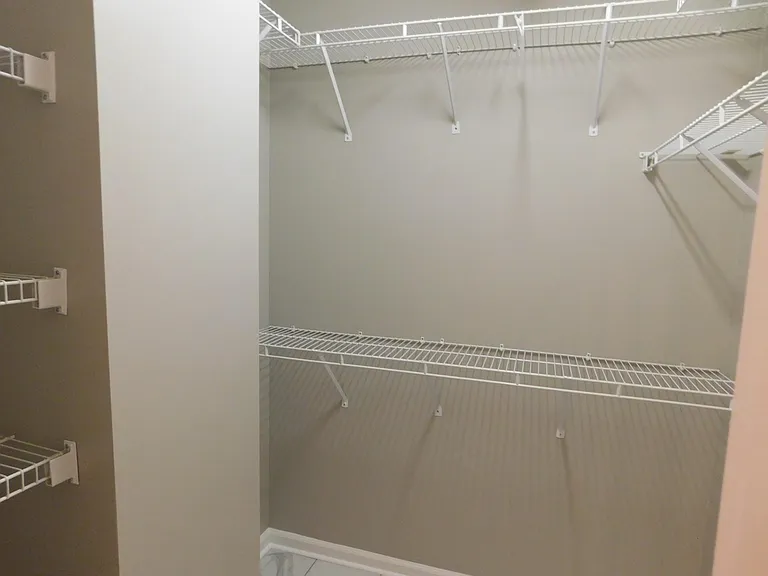 The same master bedroom walk in closet