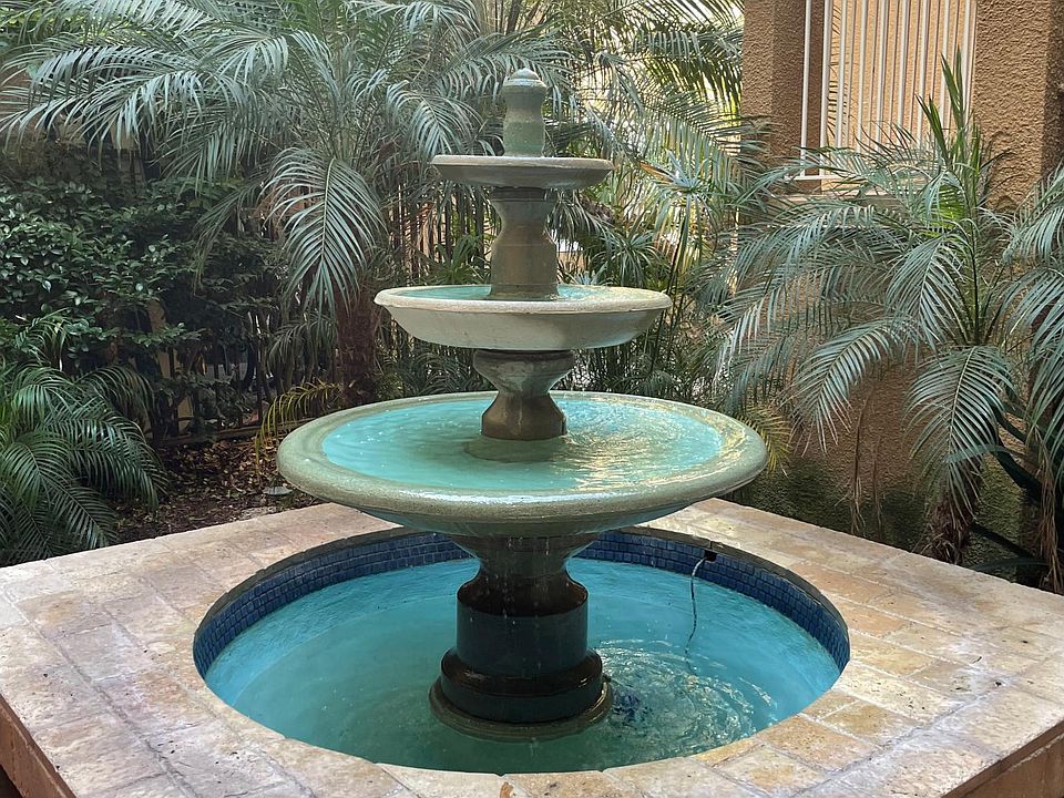 Courtyard fountain in front of front door