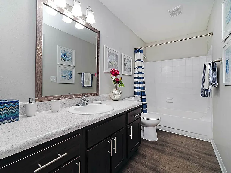 Experience luxury in this modern bathroom, featuring sophisticated design and exquisite finishes.