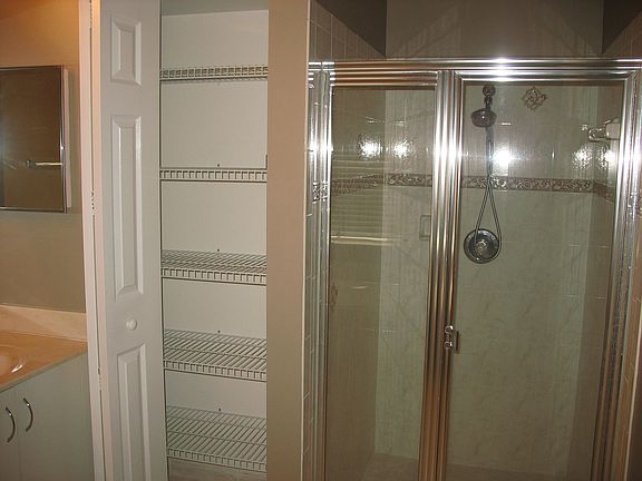 Shower and linen closet in master bath