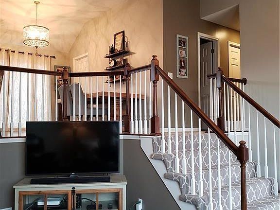Newer Carpet on stairs and hallway. New hardwood floor in living room and entryway.