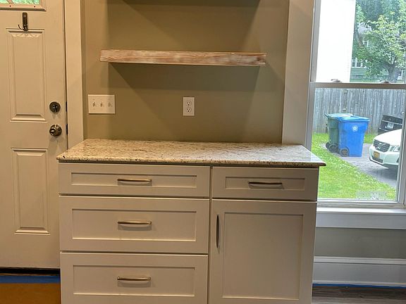 Oversized cabinetry w/ granite countertop