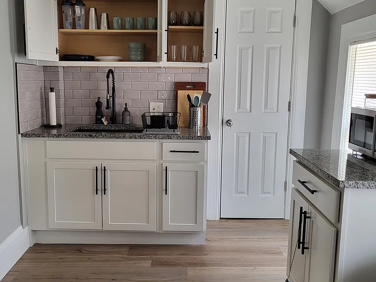 There is cabinet and pantry storage in the kitchen. Cooking tools, dishes, and utensils are all provided.