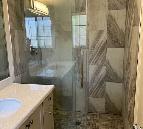 Master bathroom with wall in shower