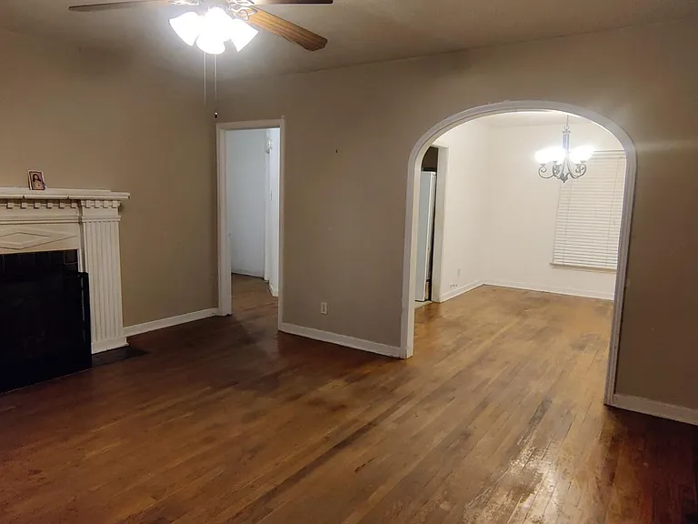 Living room w/ gas fireplace. Connecting dining room.