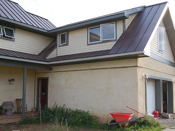 Extterior--apt is above garage; apt entry is at left