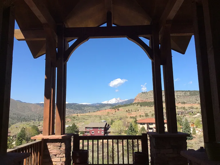 Welcome to 1022 Horizon Dr. with panoramic views of Longs Peak and Steamboat Mountain from every angle of the home.