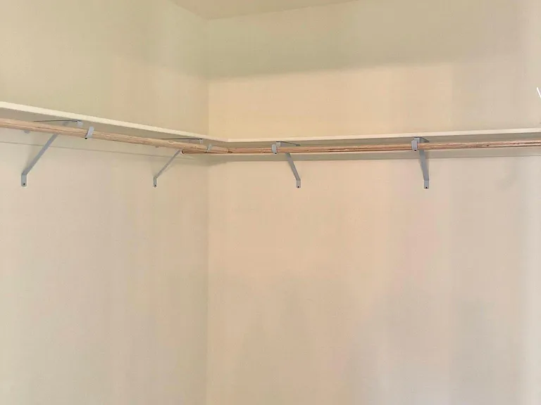 Primary bedroom walk-in closet
