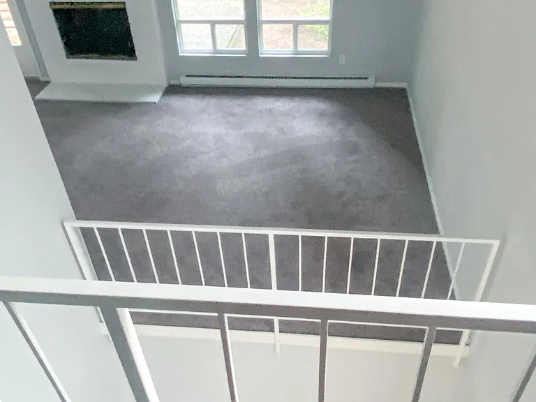 view from 2nd bedroom with loft doors open