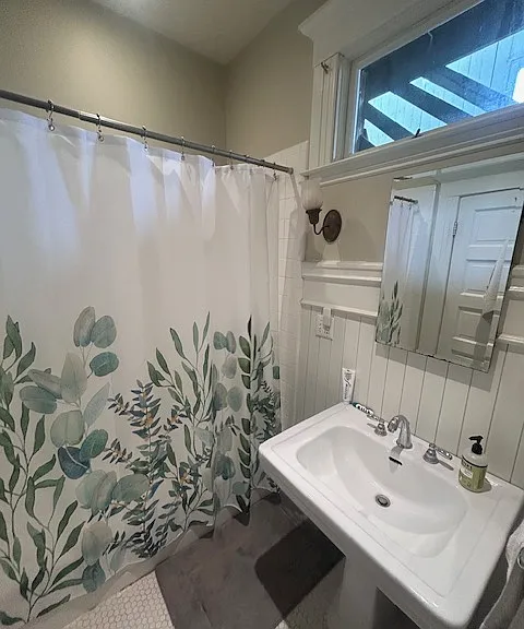 Shared bathroom with tub shower
