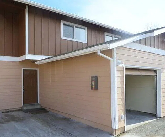 Townhouse style apartment with attached garage space and pri