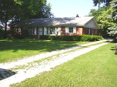 Front View, note the tree on left in yard was recently cu down but planted now are a tulip, red bud and dog wood trees.