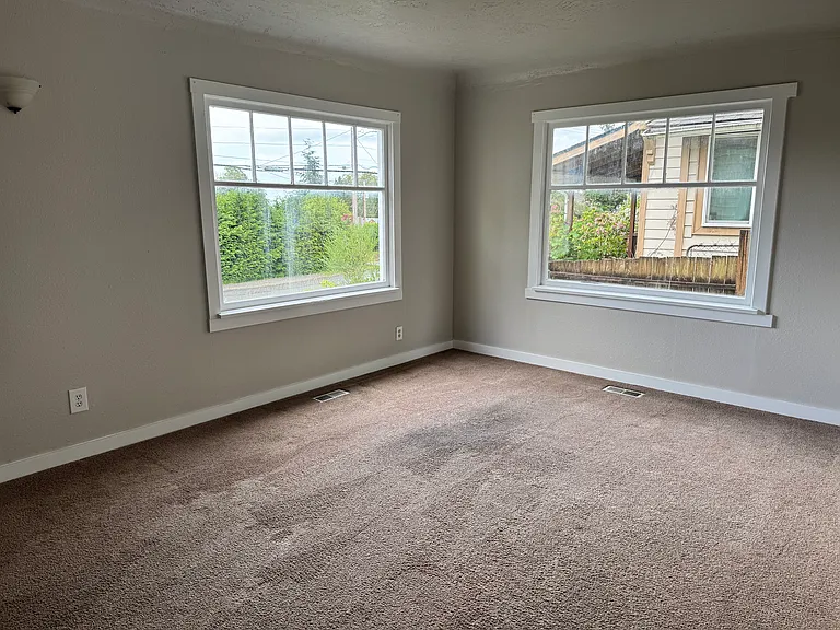 Living room with large front windows