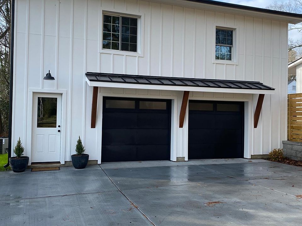 Exterior concrete and stone driveway, 1 outdoor parking space