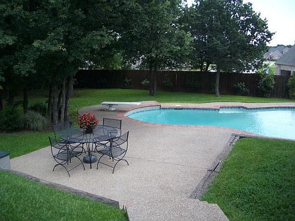 To the left, off of the patio.