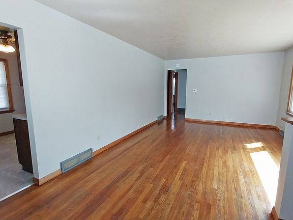 Living room with kitchen on left